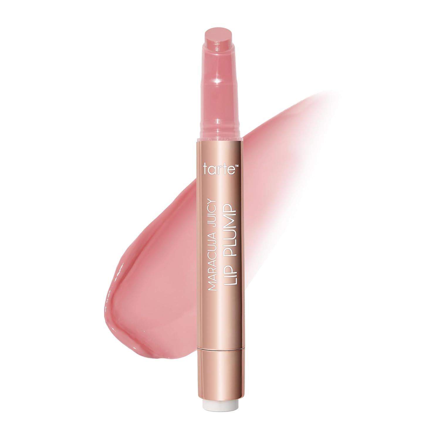 Extreme close-up of Tarte Maracuja Juicy Lip Plump glossy tube resting on a maracuja fruit slice with warm lighting