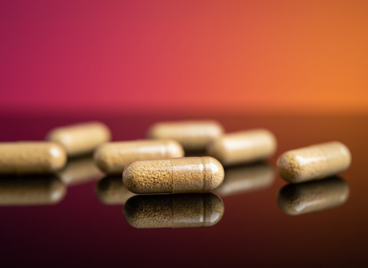 Macro close-up of vitamin B-complex vegan capsules on black glass with shallow focus