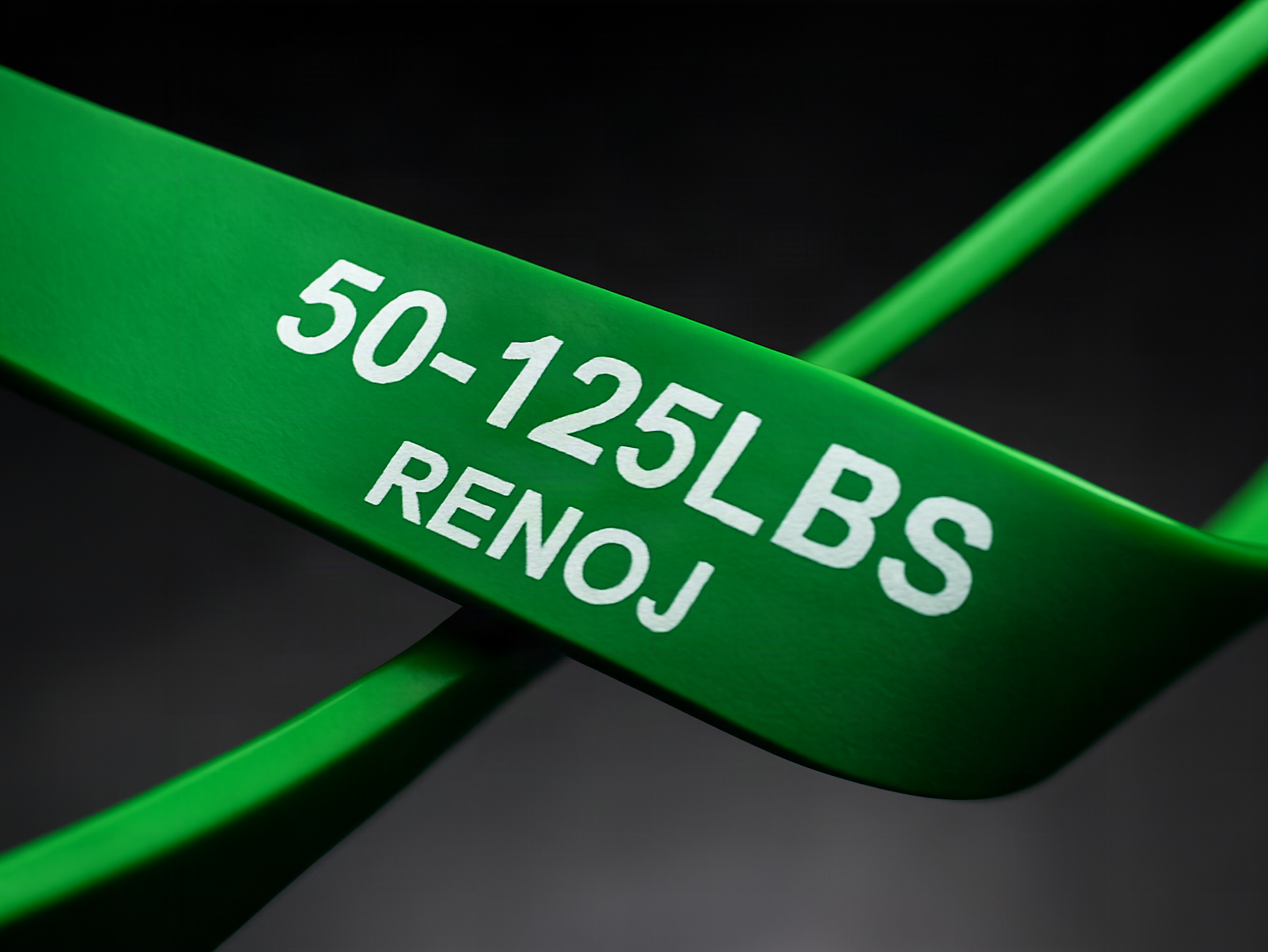 Close-up of a stretched Renoj resistance band showing detailed rubber texture and vibrant color